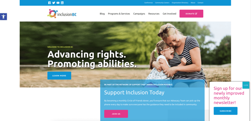 Screenshot showing Inclusion BC's homepage, which uses bright pink on CTA buttons